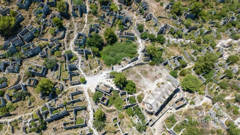 historical-lycian-village-kayakoy-fethiye-mugla-turkey-drone-aerial-shot-from-ghost-town-kayakoy-greek-village-evening-moody-warm-sun-ancient-city-stone-4
