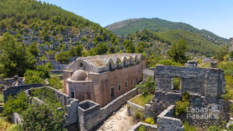 historical-lycian-village-kayakoy-fethiye-mugla-turkey-drone-aerial-shot-from-ghost-town-kayakoy-greek-village-evening-moody-warm-sun-ancient-city-stone-3