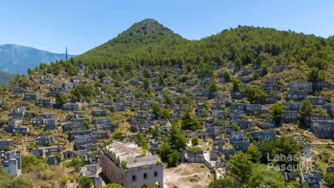 historical-lycian-village-kayakoy-fethiye-mugla-turkey-drone-aerial-shot-from-ghost-town-kayakoy-greek-village-evening-moody-warm-sun-ancient-city-stone-2
