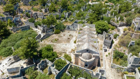 historical-lycian-village-kayakoy-fethiye-mugla-turkey-drone-aerial-shot-from-ghost-town-kayakoy-greek-village-evening-moody-warm-sun-ancient-city-stone