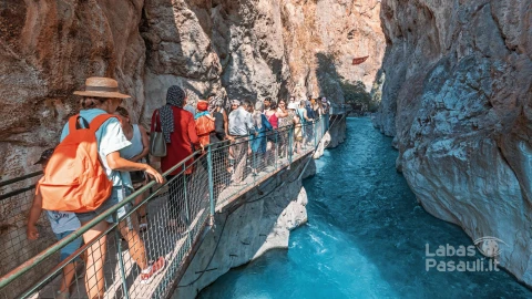 27-august-2021-saklikent-canyon-turkey-crowds-tourists-walk-along-path-bridge-along-cliff-famous-saklikent-gorge-natural-wonders-sightseeing