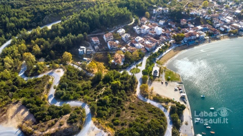 aerial-drone-view-blue-sea-windy-mountain-roads-halkidiki-greece