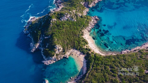 drone-shot-breathtaking-shore-porto-timoni-with-deep-tropical-blue-clear-turquoise-sea