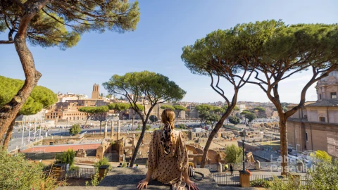 woman-enjoying-beautiful-view-from-old-centre-rome-min