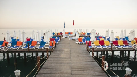 wooden-walkway-with-colorful-deckchairs