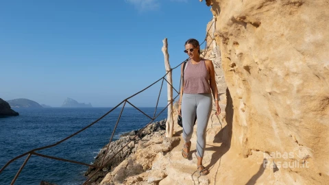 full-shot-woman-walking-rock-min