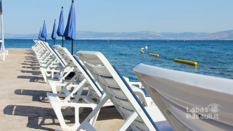 rows-empty-chaise-lounges-sea-background-supetar-brac-island-croatia-min